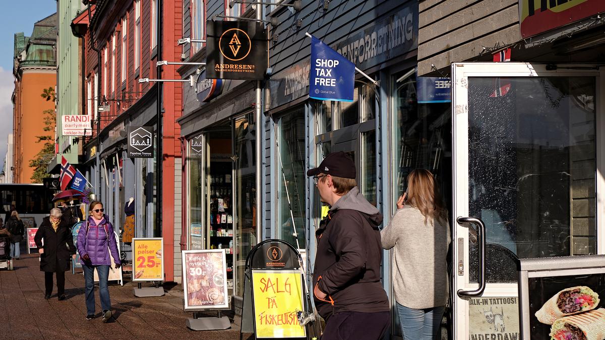 People walk past shops in Tromso, Norway September 19, 2019. REUTERS/Ints Kalnins