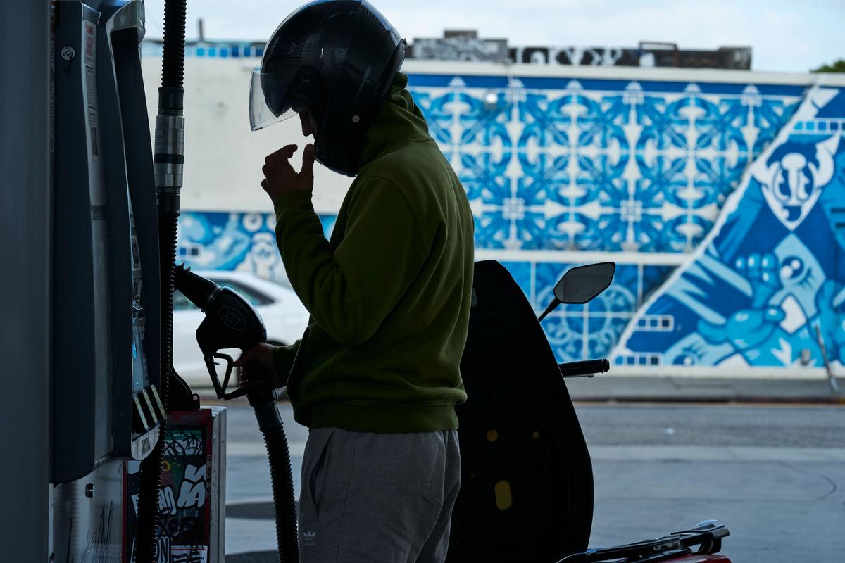  Neer Malik fills up just one gallon of gasoline to ride approximately 100 miles on his motorcycle at a gas station in Los Angeles on April 17, 2026. 