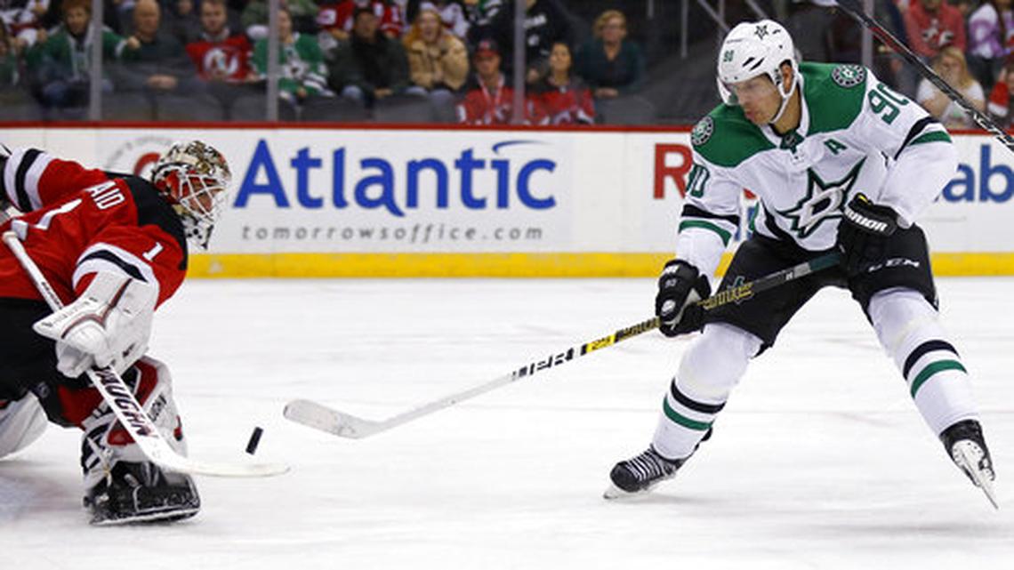 Dallas Stars center Jason Spezza (90) has his shot stopped by New Jersey Devils goaltender Keith Kinkaid in the first period of an NHL hockey game Tuesday, Oct. 16, 2018, in Newark, NJ.