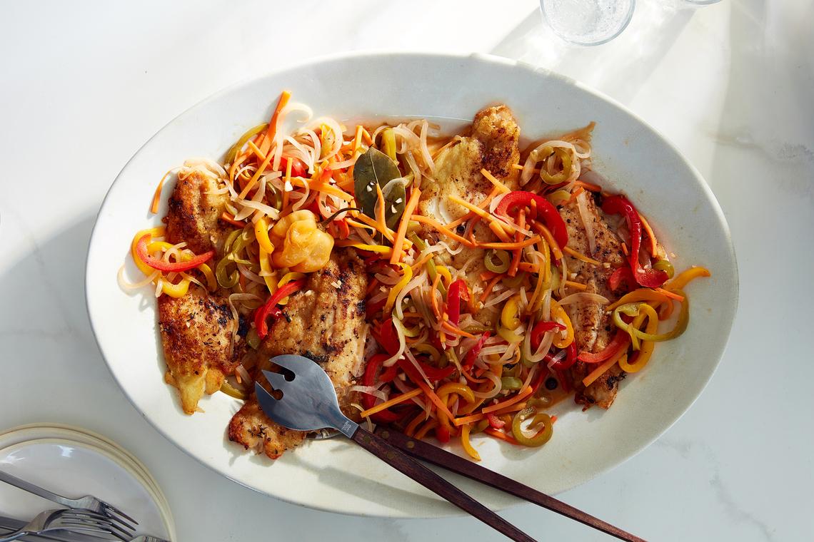 Snapper escovitch. You can always serve the fish plain kids and hoard the magnificent topping for the adults. Food styled by Barrett Washburne. (Dane Tashima/The New York Times)