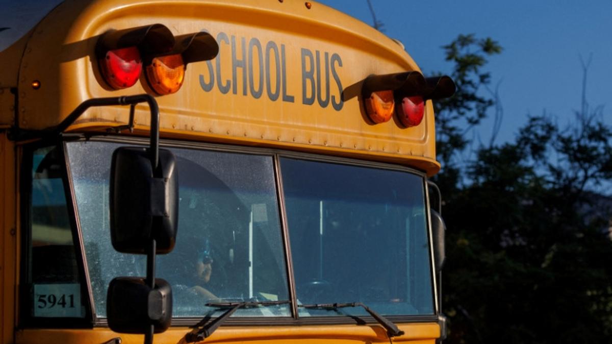 FILE PHOTO: File Photo: A school bus driver navigates while driving through downtown Los Angeles, California, U.S. July 19, 2023.  REUTERS/Mike Blake/File Photo