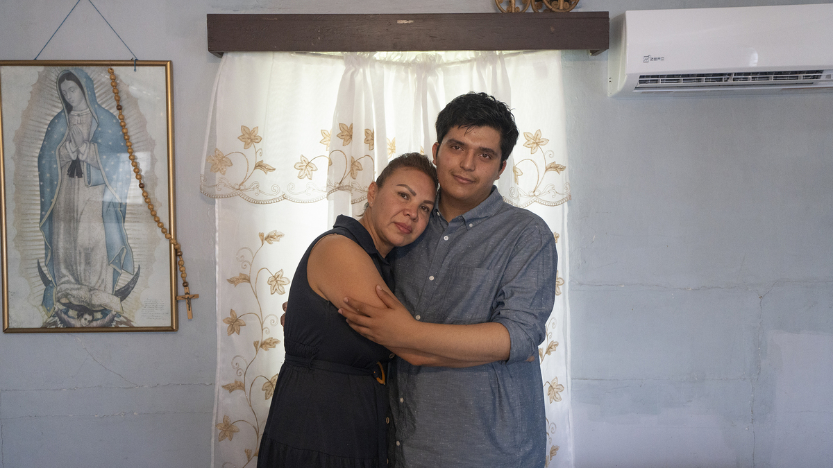 Damian embraces his aunt Claudia Zermeño, who has taken legal guardianship of him since his father was deported to Mexico. She’s caring for him, her two children, and her mother. (Karla Gachet/KFF Health News/TNS)