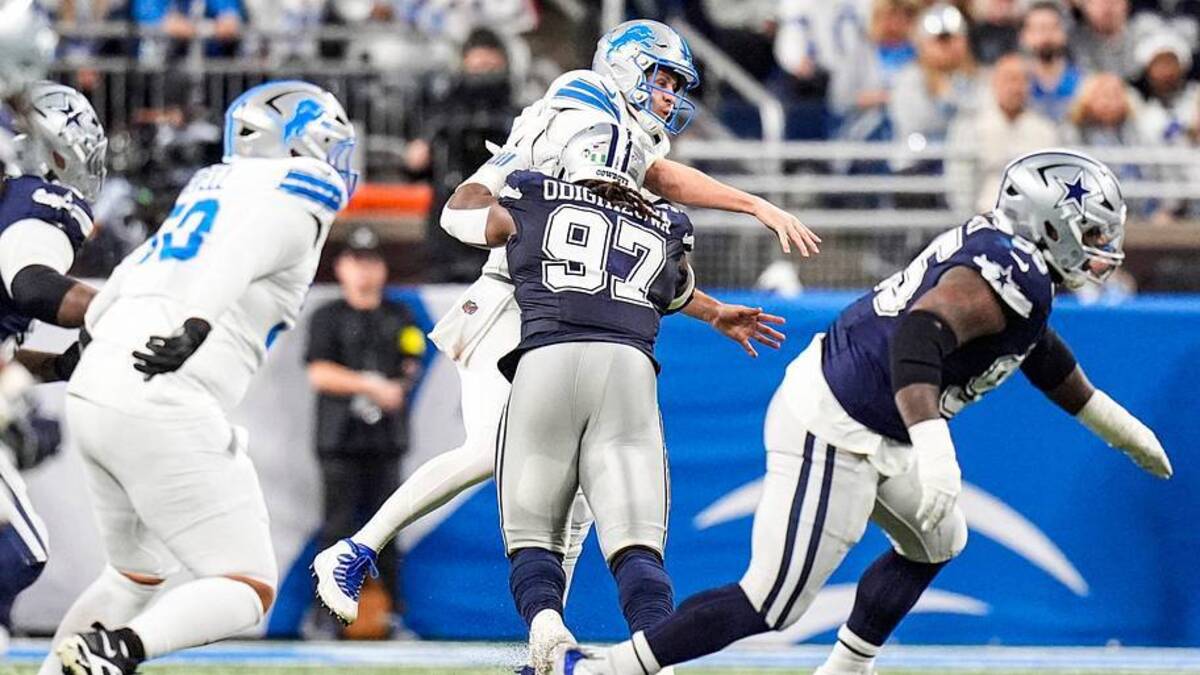  Detroit Lions quarterback Jared Goff (16) is tackled by Dallas Cowboys defensive tackle Osa Odighizuwa (97) during the first half at Ford Field in Detroit on Thursday, Dec. 4, 2025. | Junfu Han / USA TODAY NETWORK via Imagn Images 
