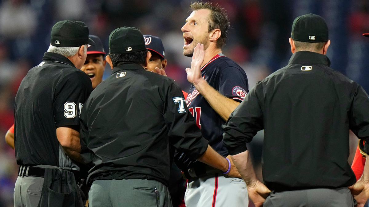 Washington Nationals pitcher Max Scherzer reacts as he talks with umpires during a foreign substances check in the middle of the fourth inning of a baseball game against the Philadelphia Phillies, Tuesday, June 22, 2021, in Philadelphia. (AP Photo/Matt Slocum)