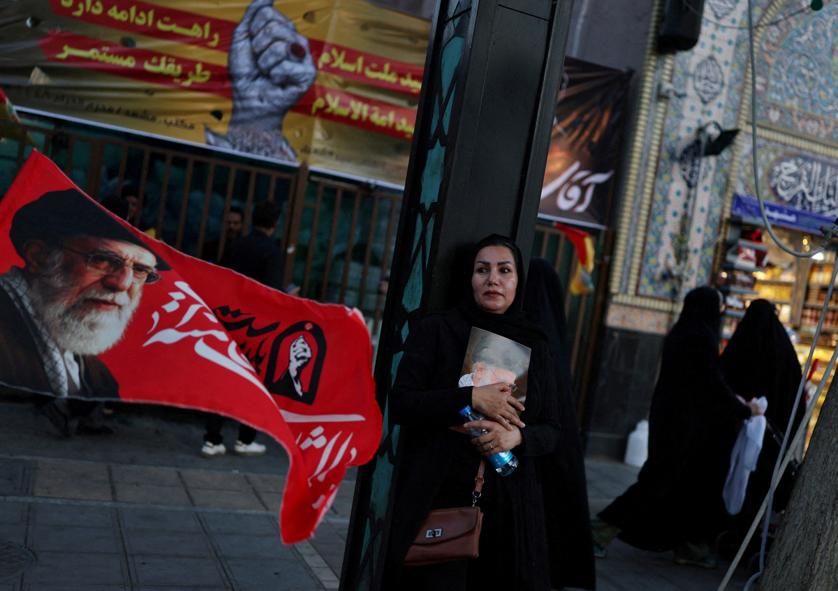 A woman reacts during a gathering a day before the burial of Iran's late Supreme Leader Ayatollah Ali Khamenei, who was killed on February 28 in Israeli and U.S. airstrikes, in Mashhad, Iran, July 8, 2026. REUTERS/Mohammed Salem   Foreign media in Iran operate under guidelines set by the Ministry of Culture and Islamic Guidance, which regulates press activity and permissions