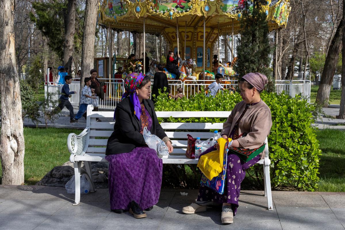 Women chat at an amusement park in Ashgabat, Turkmenistan, March 20, 2026. REUTERS/Umit Bektas