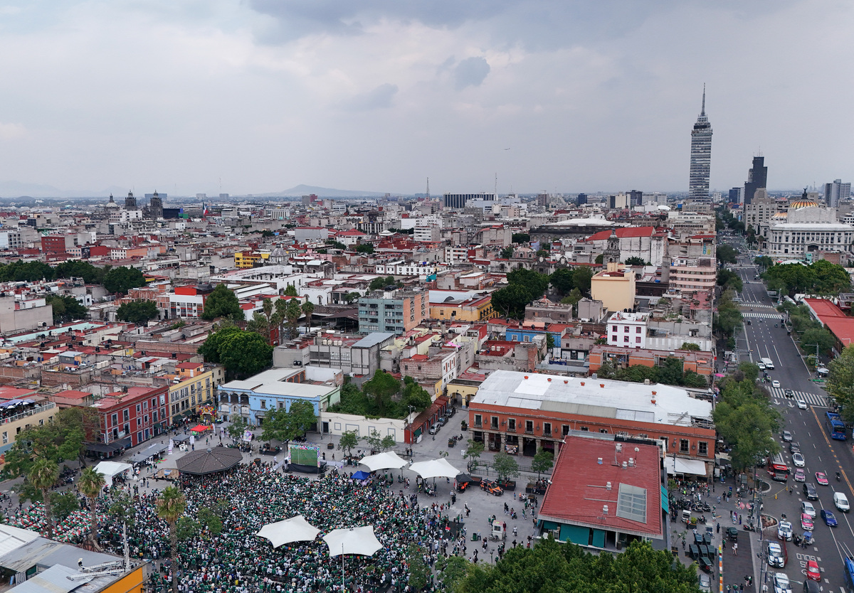 A drone view shows fans during a public viewing of the opening game of the 2026 FIFA World Cup in Plaza Garibaldi, as many Mexicans say they feel excluded despite the tournament's return to the country, citing high ticket prices, paid television access and strict commercial restrictions, in Mexico City, Mexico, June 11, 2026. REUTERS/Armando Vega