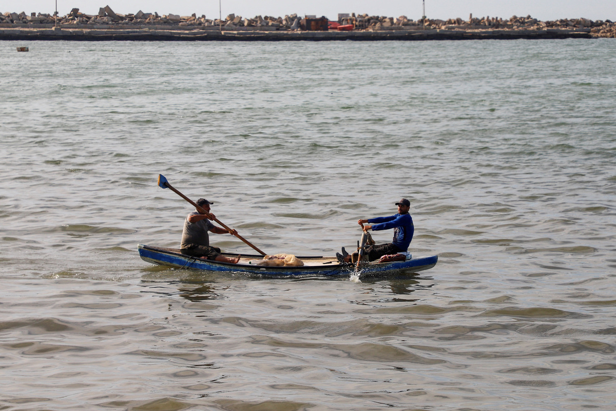 Palestinian fishermen use a skiff off the coast of Gaza City, June 3, 2026. REUTERS/Ebrahim Hajjaj