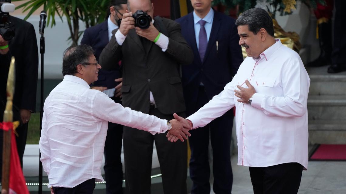 Colombian President Gustavo Petro, left, shakes hands with Venezuelan leader Nicolás Maduro at the presidential palace in Caracas, Venezuela, on Nov. 1.