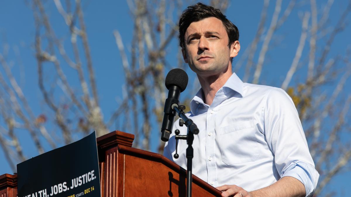 Jon Ossoff speaks to the crowd during an outdoor drive-in rally on December 5, 2020 in Conyers, Georgia. 