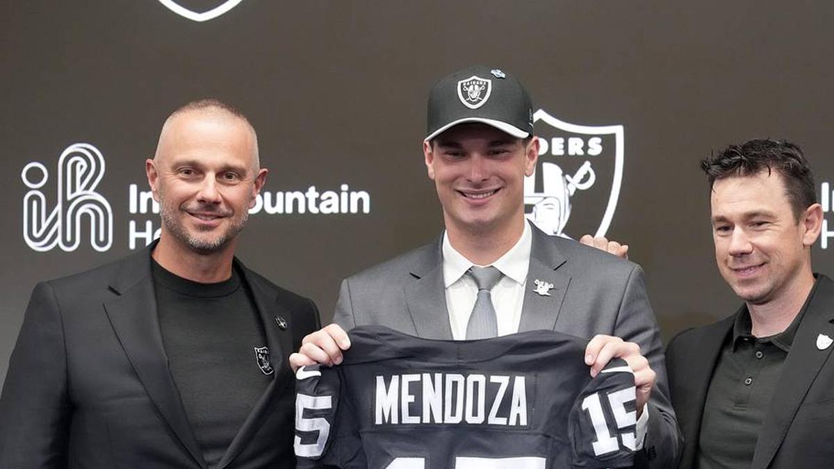 Apr 24, 2026; Henderson, NV, USA; Las Vegas Raiders quarterback Fernando Mendoza (center) poses with general manager John Spytek (left) and head coach Klint Kubiak at introductory press conference at Intermountain Health Performance Center after being selected as the No. 1 pick in the 2026 NFL Draft. Mandatory Credit: Kirby Lee-Imagn Images | Kirby Lee-Imagn Images 
