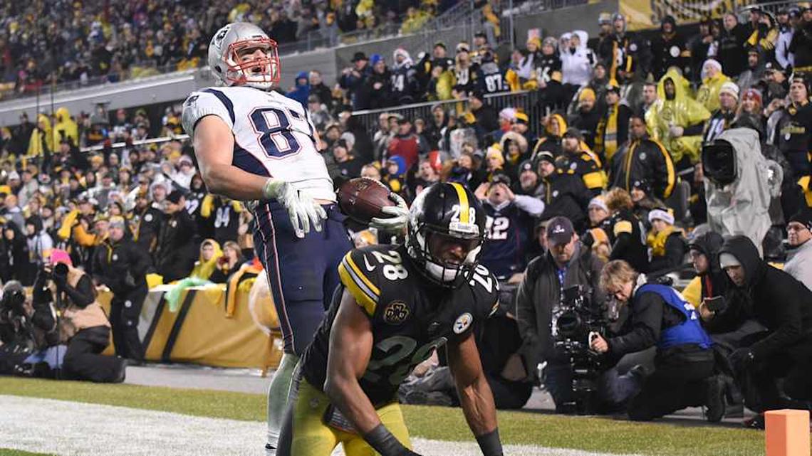  Dec 17, 2017; Pittsburgh, PA, USA; New England Patriots tight end Rob Gronkowski (87) celebrates a two point conversion in the fourth quarter as Pittsburgh Steelers safety Sean Davis (28) looks away at Heinz Field. The Patriots won 27-24. Mandatory Credit: Philip G. Pavely-Imagn Images | Philip G. Pavely-Imagn Images 