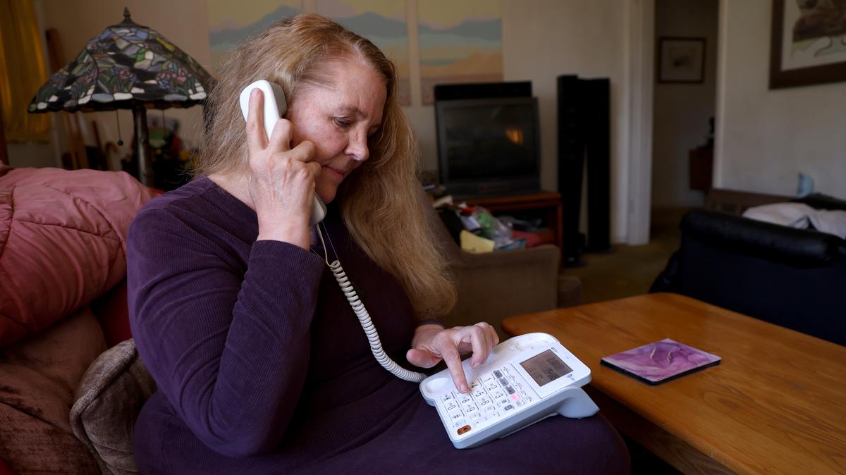 Author, life coach and motivational speaker Cynthia Larson uses her land line telephone at her home in Berkeley, Calif., on Monday, July 28, 2025. Larson does not use a cell phone. (Jane Tyska/Bay Area News Group)