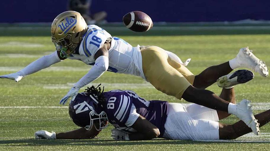  Sep 27, 2025; Evanston, Illinois, USA; UCLA Bruins defensive back Rodrick Pleasant (18) defends Northwestern Wildcats wide receiver Hayden Eligon II (80) during the second half at Northwestern Medicine Field at Martin Stadium. Mandatory Credit: David Banks-Imagn Images | David Banks-Imagn Images 