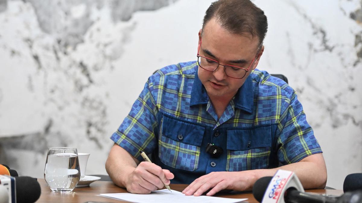 Philippine Senate President Alan Peter Cayetano signs the confirmation letter of the Articles of Impeachment against Vice President Sara Duterte at the Philippine Senate, in Pasay City, Metro Manila, Philippines, May 14, 2026. REUTERS/Noel Celis