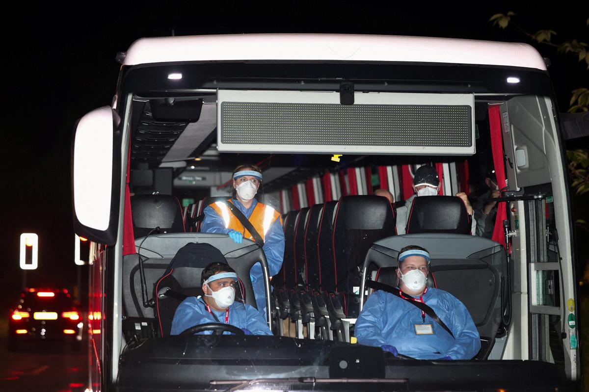 A bus transporting repatriated British nationals from the cruise ship MV Hondius, which was affected by a hantavirus outbreak, arrives at Arrowe Park Hospital, which will be used to house the repatriated, in Birkenhead, Britain, May 10, 2026. REUTERS/Temilade Adelaja