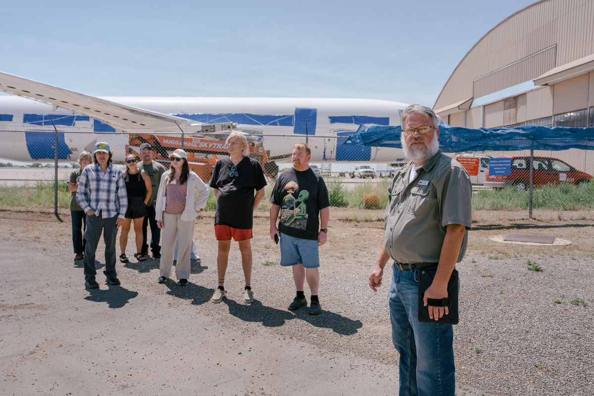 Paul T. Semones leads a tour during city's annual UFO festival in Roswell, N.M, on Friday, July 3, 2026. The festival was supposed to be full of triumphant "told you so's" after the Trump administration declassified its alien files. Instead, apparently, the coverup continues. (Paul Ratje/The New York Times)