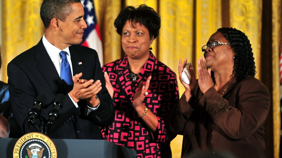 President Barack Obama (L) claps with Louvon Harris (C) and Betty Byrd Boatner, the sisters of James Byrd, Jr., who was a victim of a hate crime, as he delivers remarks on the passing of the Matthew Shepard Hate Crimes Prevention Act, at the White House in Washington on October 28, 2009. On June 7, 1998, three white supremacists killed Byrd by dragging him for 3 miles behind a pickup truck in Jasper, Texas. File Photo by Kevin Dietsch/UPI