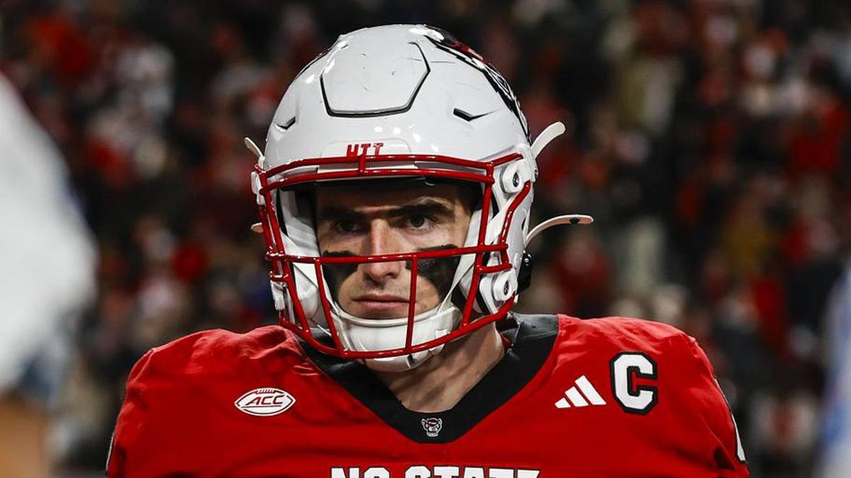 Nov 29, 2025; Raleigh, North Carolina, USA; NC State Wolfpack defensive end Cian Slone (8) at the coin toss before the first half of the game against North Carolina Tar Heels at Carter-Finley Stadium. Mandatory Credit: Jaylynn Nash-Imagn Images | Jaylynn Nash-Imagn Images 