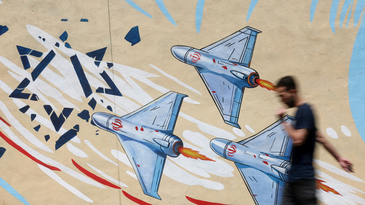 An Iranian man walks next to an anti-Israeli mural on a street in Tehran, Iran June 6, 2026. Majid Asgaripour/WANA (West Asia News Agency) via REUTERS