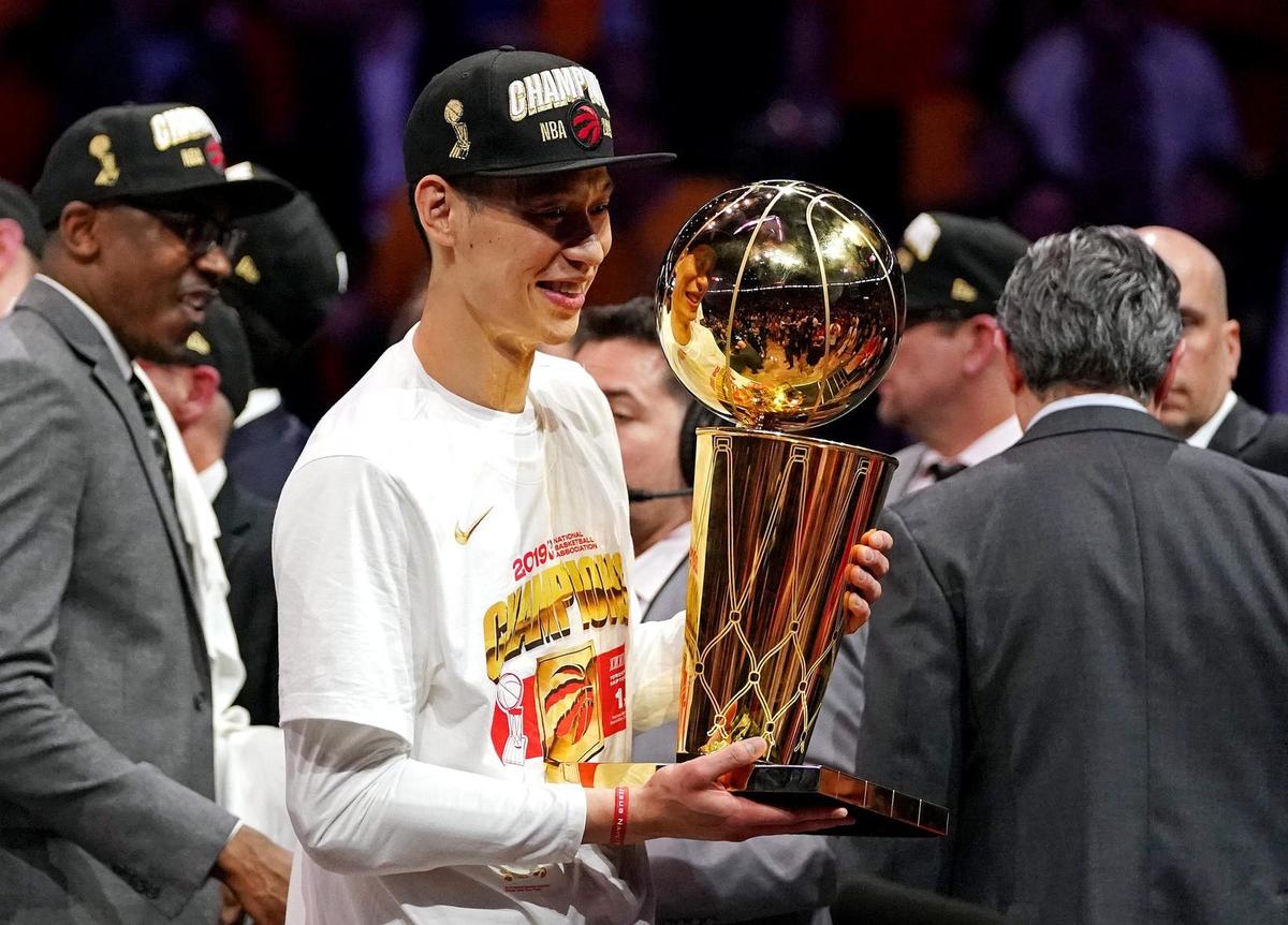 Jun 13, 2019; Oakland, CA, USA; Toronto Raptors guard Jeremy Lin (17) celebrates with the Larry O'Brian Trophy after beating the Golden State Warriors in game six of the 2019 NBA Finals at Oracle Arena. Mandatory Credit: Kyle Terada-USA TODAY Sports