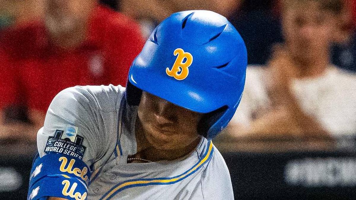  Jun 17, 2025; Omaha, Neb, USA; UCLA Bruins first baseman Mulivai Levu (39) hits a triple against the Arkansas Razorbacks during the ninth inning at Charles Schwab Field. Mandatory Credit: Dylan Widger-Imagn Images | Dylan Widger-Imagn Images 