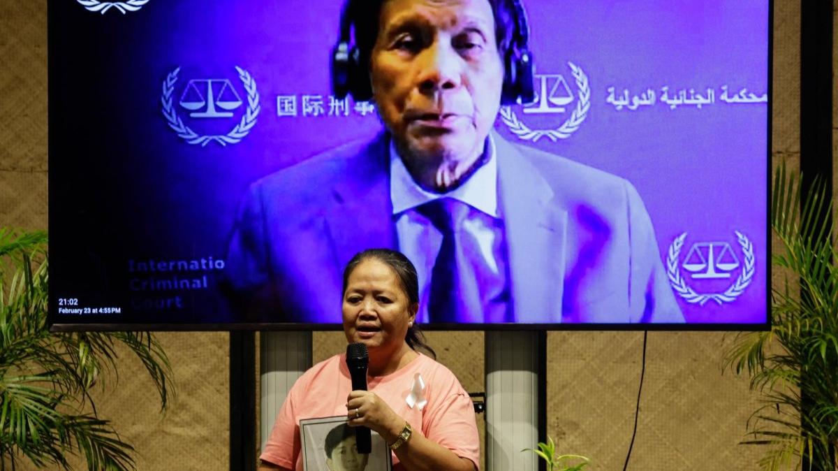Dahlia Cuartero, mother of a victim of an alleged extrajudicial killing during the war on drugs campaign of former Philippine President Rodrigo Duterte, holds a picture of her son prior to watching a broadcast of an International Criminal Court proceeding from Quezon City, Metro Manila, Philippines, on Feb. 23. File Photo by Rolex Dela Pena/EPA