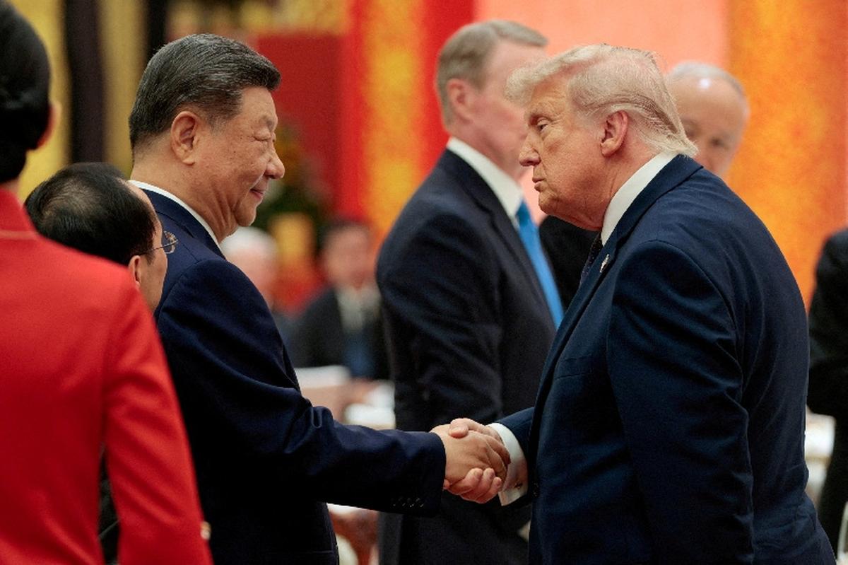 Chinese President Xi Jinping and U.S. President Donald Trump shake hands at a state banquet at the Great Hall of the People in Beijing, China, May 14, 2026. REUTERS/Evan Vucci