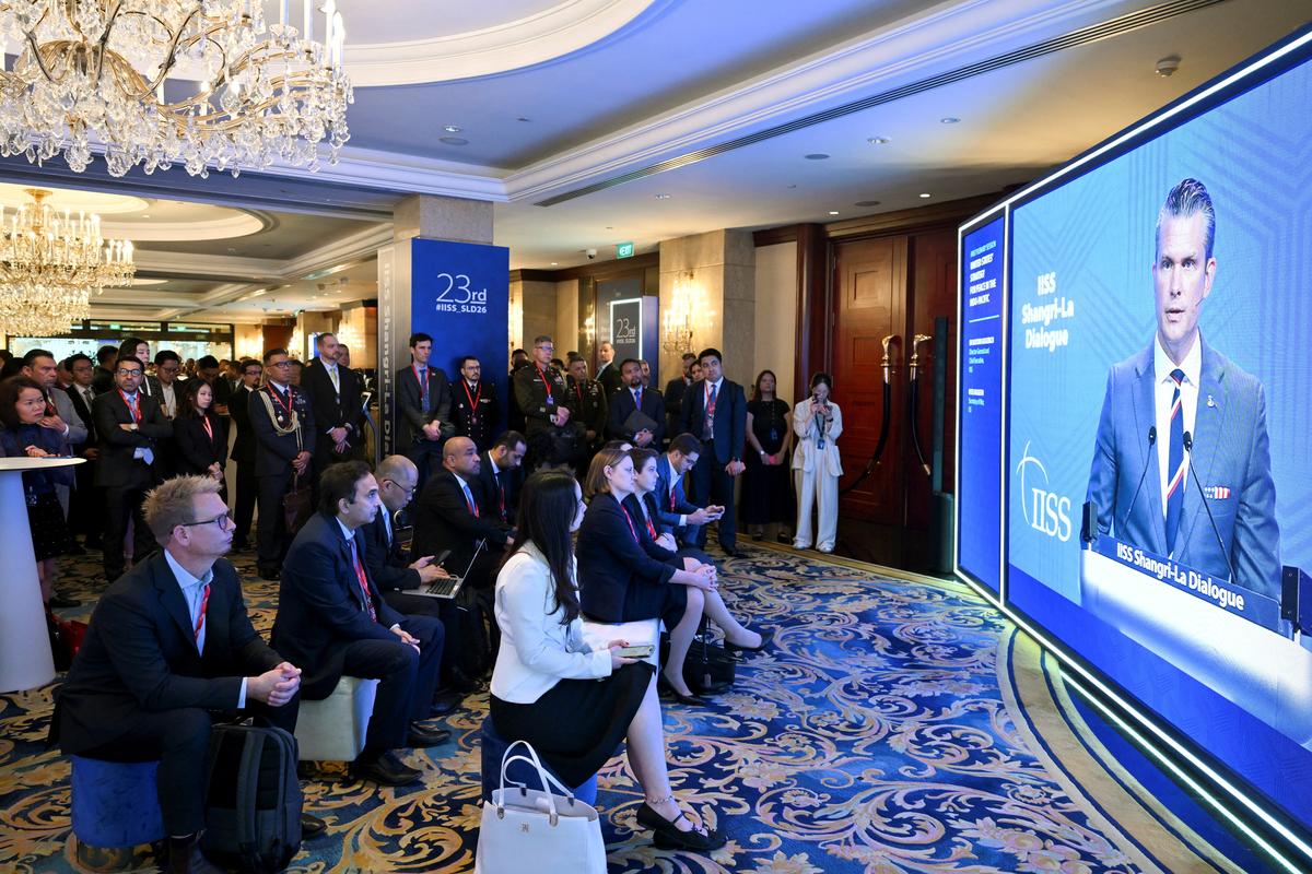 Delegates view U.S Secretary of Defense Pete Hegseth's speech on a screen at the Shangri-La Dialogue security summit in Singapore May 30, 2026. REUTERS/Caroline Chia