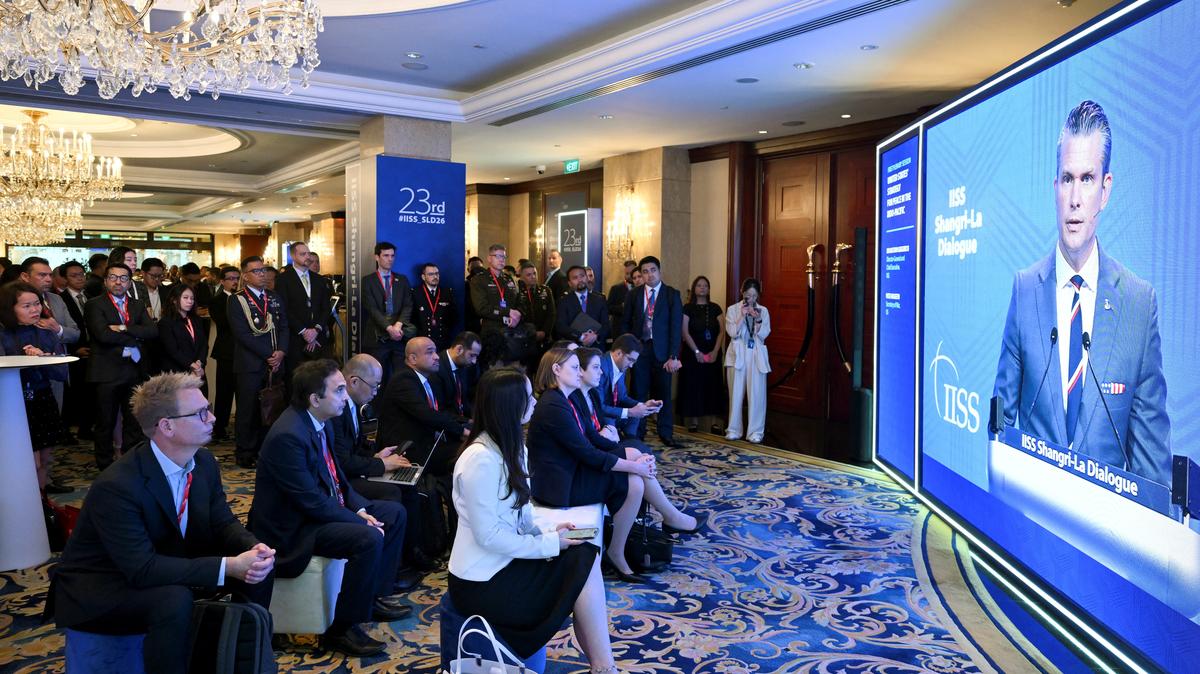 Delegates view U.S Secretary of Defense Pete Hegseth's speech on a screen at the Shangri-La Dialogue security summit in Singapore May 30, 2026. REUTERS/Caroline Chia