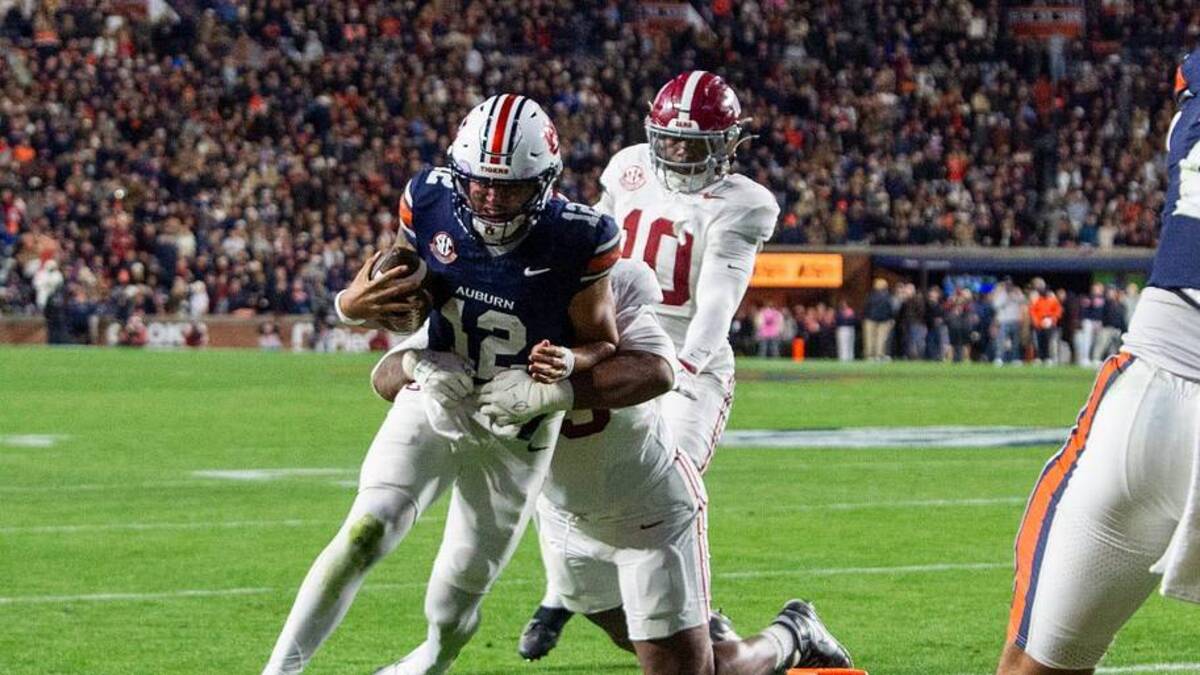  Auburn Tigers quarterback Ashton Daniels (12) runs the ball as Auburn Tigers take on Alabama Crimson Tide in the Iron Bowl at Jordan-Hare Stadium in Auburn, Ala. on Saturday, Nov. 29, 2025. Alabama Crimson Tide leads Auburn Tigers 17-6. | Jake Crandall/ Advertiser / USA TODAY NETWORK via Imagn Images 