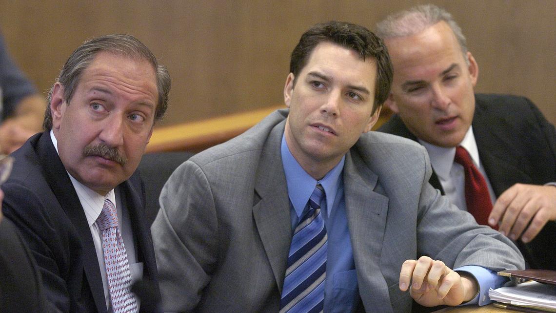 FILE - Scott Peterson, center, with defense attorneys Mark Geragos, left, and Pat Harris listens to judge Alfred A. Delucchi in a Redwood City, Calif., courtroom, Thursday, July 29, 2004. On Monday, August 24, 2020, the California Supreme Court overturned the 2005 death sentence for Peterson in the slaying of his pregnant wife. The court says prosecutors may try again for the same sentence if they wish in the high-profile case. It upheld his 2004 conviction of murdering Laci Peterson, who was eight months pregnant with their unborn son. (Al Golub/The Modesto Bee,Pool)