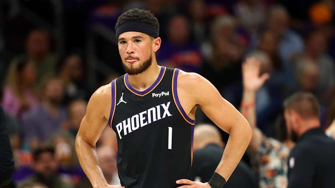  Apr 14, 2026; Phoenix, Arizona, USA; Phoenix Suns guard Devin Booker (1) reacts against the Portland Trail Blazers in the first half during the play-in rounds of the 2026 NBA Playoffs at Mortgage Matchup Center. | Mark J. Rebilas-Imagn Images 