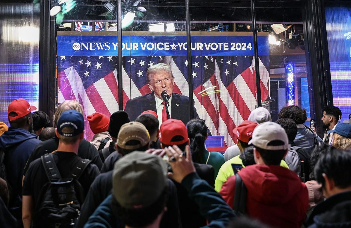  New York City residents watch Donald Trump speak as votes are tallied for the presidential election on Nov. 6, 2024. Fatih Aktas/Anadolu via Getty Images 