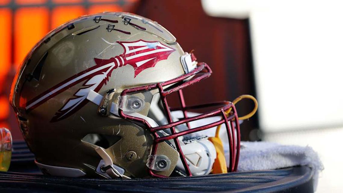  Nov 25, 2017; Gainesville, FL, USA; Florida State Seminoles helmet lays on the field against the Florida Gators during the second half at Ben Hill Griffin Stadium. Mandatory Credit: Kim Klement-Imagn Images | Kim Klement-Imagn Images 