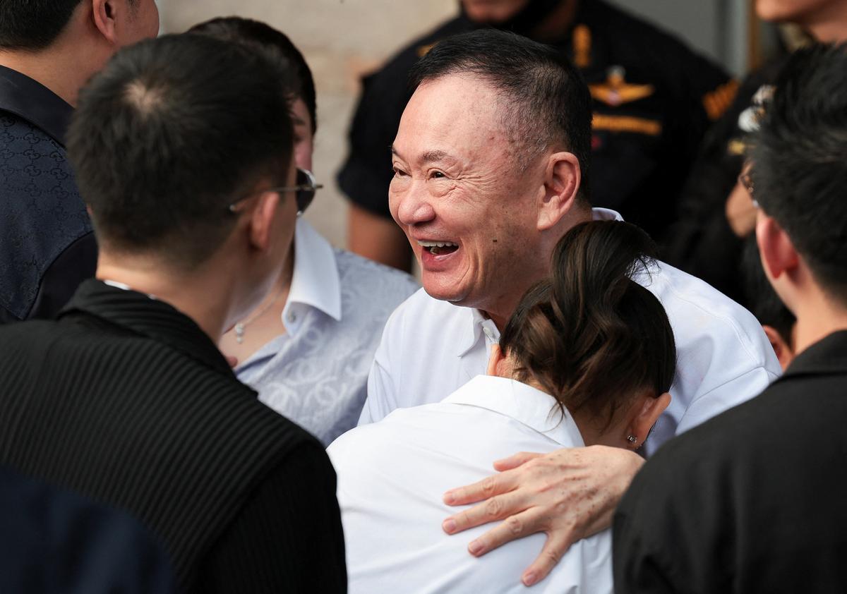 Former Thai Prime Minister Thaksin Shinawatra reacts following his release on parole after serving eight months of his one-year sentence at Klong Prem Central Prison, in Bangkok, Thailand, May 11, 2026. REUTERS/Chalinee Thirasupa