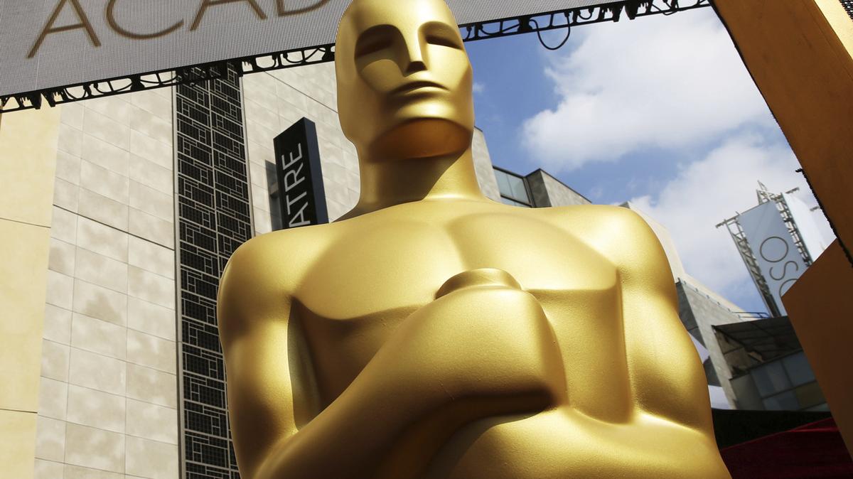 In this Feb. 21, 2015 file photo, an Oscar statue appears outside the Dolby Theatre for the 87th Academy Awards in Los Angeles.