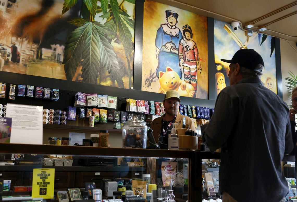  A budtender helps customers purchase marijuana at California Street Cannabis Company on Aug. 11, 2025, in San Francisco. Justin Sullivan/Getty Images 