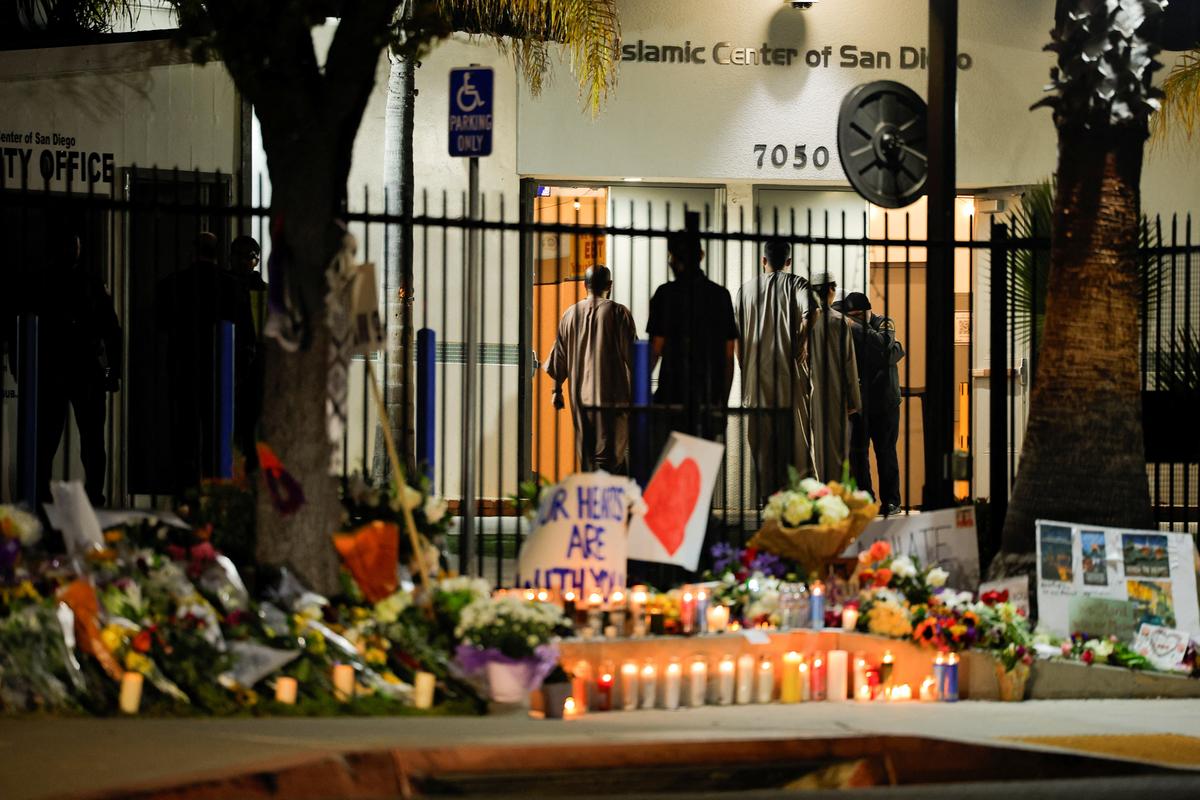 People arrive to take part in an early morning call to prayer at the Islamic Center of San Diego as it opens for the first time following a shooting, in San Diego, California, U.S., May 20, 2026. REUTERS/Mike Blake