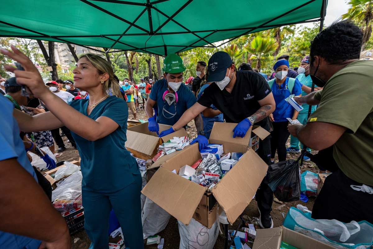 Medical staff and students sort medicines to distribute to displaced people at a park in Caraballeda, La Guaira state, Venezuela, June 30, 2026, in the aftermath of earthquakes.    MIGUEL MEDINA/Pool via REUTERS