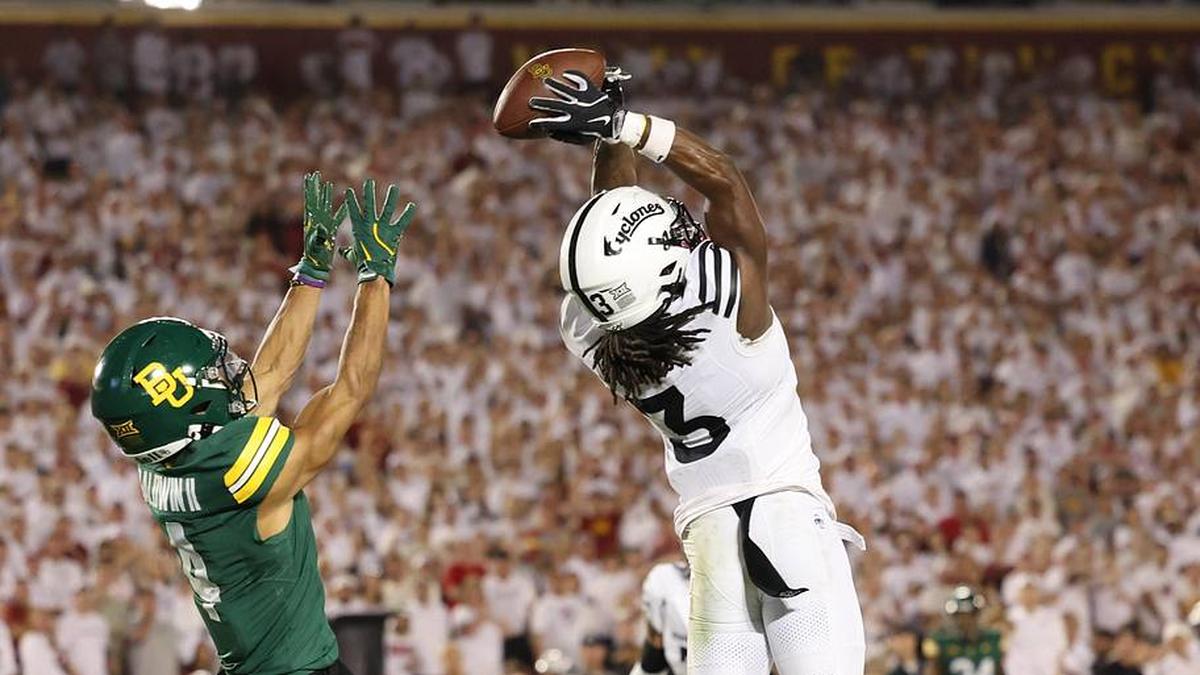  Oct 5, 2024; Ames, Iowa, USA; Iowa State Cyclones defensive back Jontez Williams (3) intercepts a pass intended for Baylor Bears wide receiver Monaray Baldwin (4) at Jack Trice Stadium. Mandatory Credit: Reese Strickland-Imagn Images | Reese Strickland-Imagn Images 