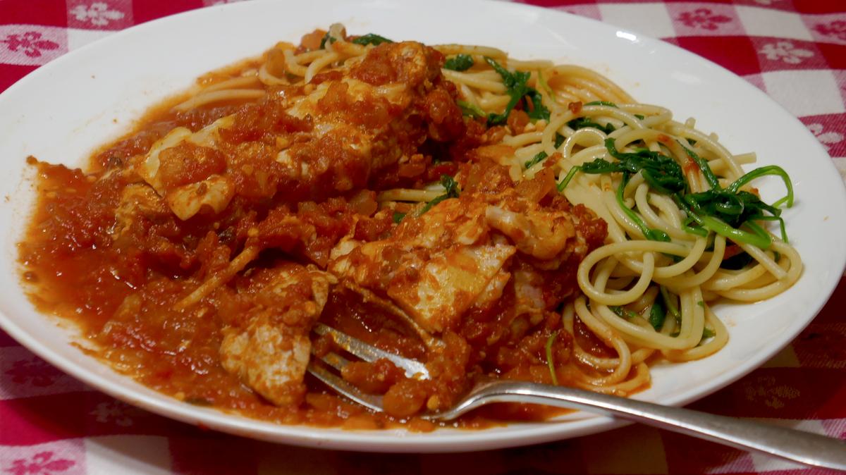 Pork Parmesan with Spaghetti with Peppery Arugula. (Linda Gassenheimer/TNS)