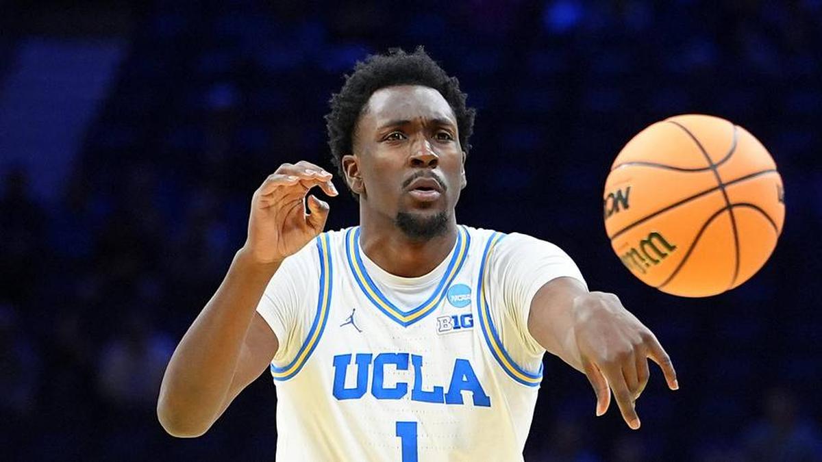  Mar 20, 2026; Philadelphia, PA, USA; UCLA Bruins center Xavier Booker (1) makes a pass against the UCF Knights in the first half during a first round game of the men's 2026 NCAA Tournament at Xfinity Mobile Arena. Mandatory Credit: Kyle Ross-Imagn Images | Kyle Ross-Imagn Images 