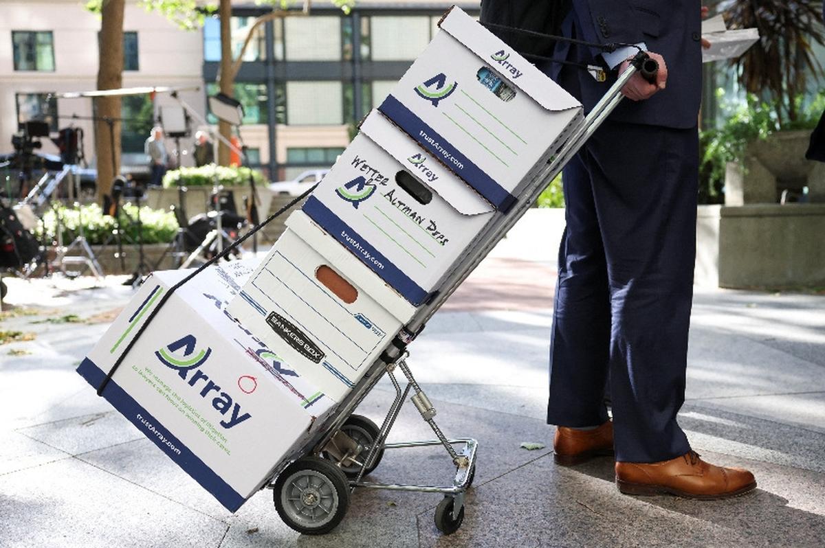Boxes related to Elon Musk's lawsuit over OpenAI's for-profit conversion trail are moved into the federal courthouse, as the trial continues, in Oakland, California, U.S., May 18, 2026. REUTERS/Manuel Orbegozo