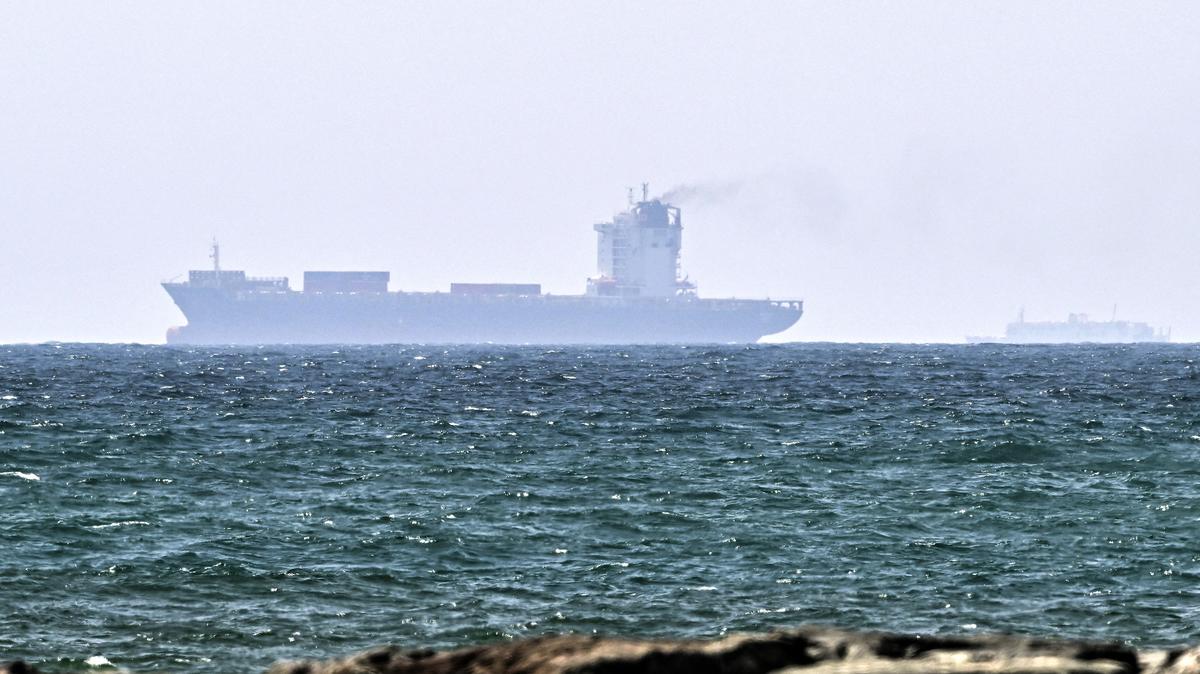 Vessels are seen off the coast of Sharjah in the United Arab Emirates on May 21, 2026. Iran's new body overseeing the Strait of Hormuz said its claimed area of control extends to Emirati waters, drawing a sharp rebuke from the Gulf neighbor. Traffic through Hormuz, a vital global shipping conduit, has come under Iranian control since the outbreak of war with Israel and the United States on February 28. (AFP via Getty Images/TNS)