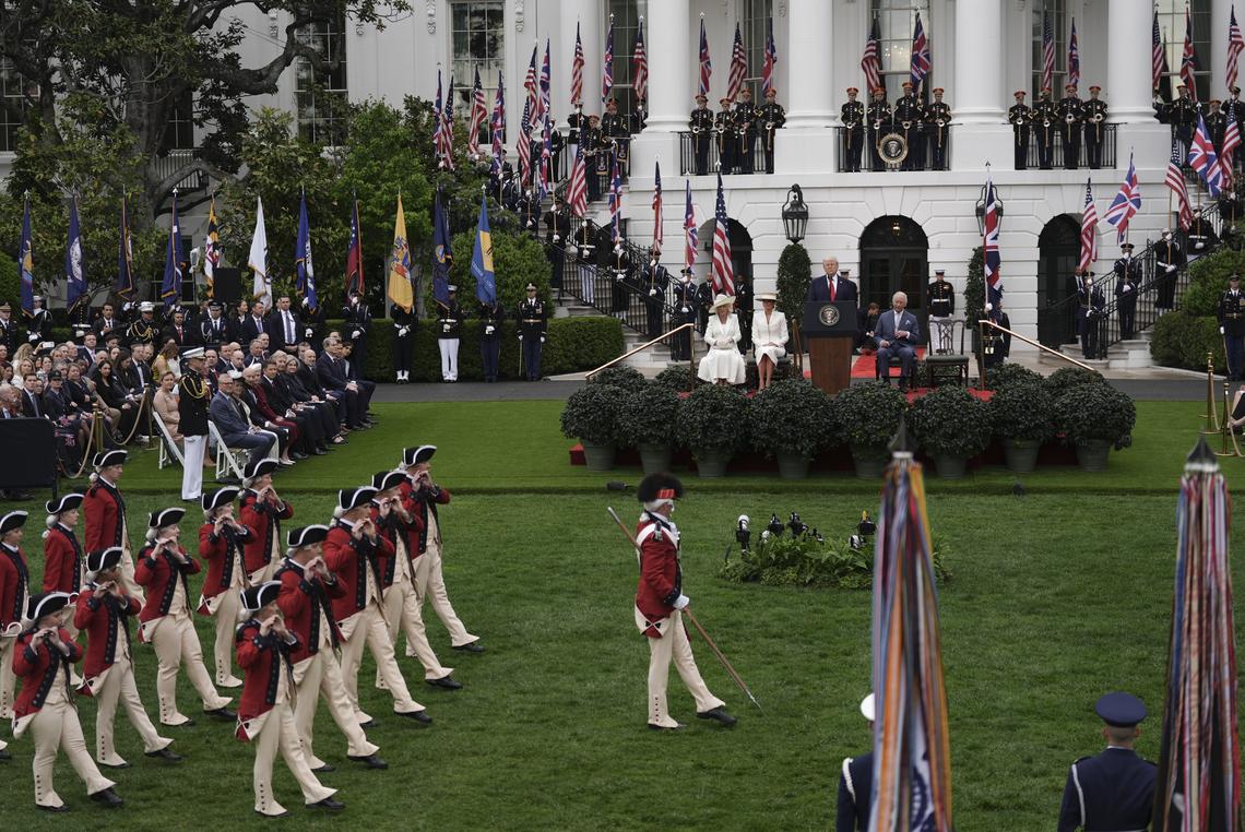 From right: King Charles III, President Donald Trump, first lady Melania Trump and Queen Camilla watch as members of the U.S. Army Old Guard Fife and Drum Corps perform during an arrival ceremony on the South Lawn of the White House in Washington, on Tuesday, April 28, 2026. (Salwan Georges/The New York Times)