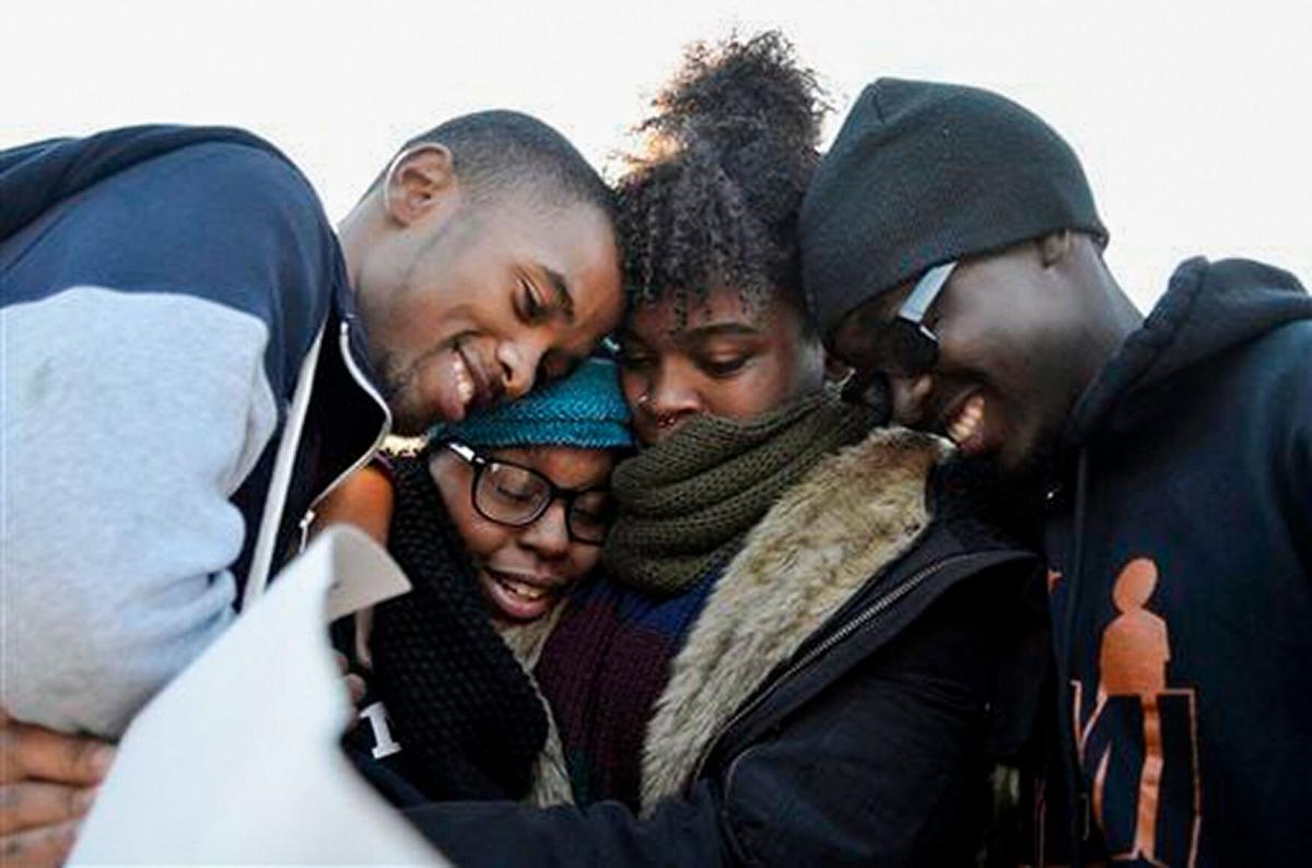 Members of Concerned Student 1950 embrace after the announcement that UM System President Tim Wolfe would resign on Nov. 9, 2015. Jonathan Butler said the president's resignation was only the beginning.