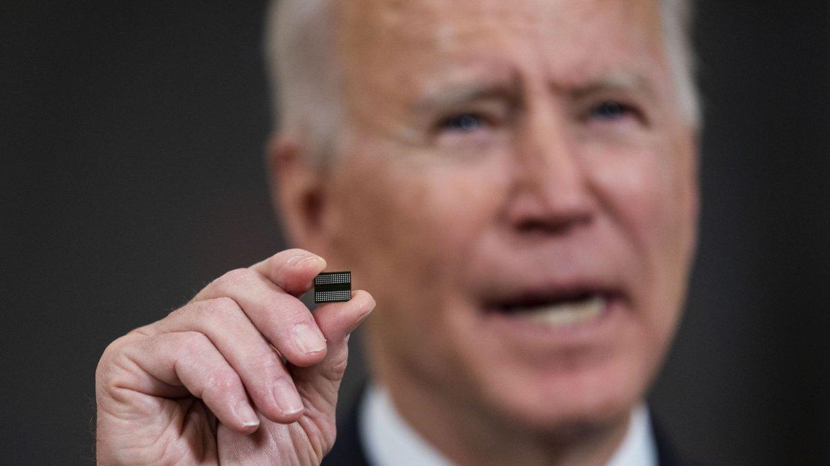 President Joe Biden holds up a semiconductor in February 2021 as he signs an executive order to address a chip shortage. On Monday, his administration announced hundreds of millions of dollars in funding for a new institute aimed at preventing the United States from being affected if a similar global shortage of semiconductors were to occur. Pool File Photo by Doug Mills/UPI