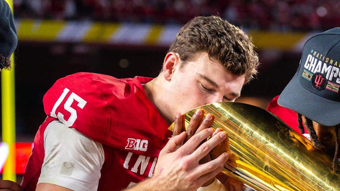 Indiana's Fernando Mendoza (15) an D'Angelo Ponds (5) kiss the trophy after the College Football Playoff National Championship college football game at Hard Rock Stadium in Miami Gardens on Monday, Jan. 19, 2026. | Rich Janzaruk/Herald-Times / USA TODAY NETWORK via Imagn Images 