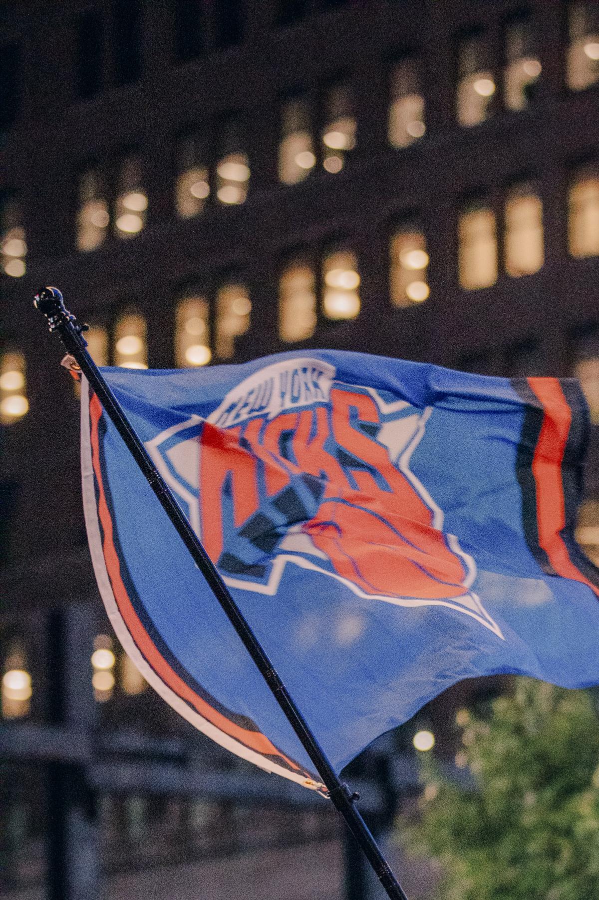 New York Knicks fans cheer the team at a watch party for Game 2 of the NBA Eastern Conference Finals outside Madison Square Garden in New York, May 21, 2026. The police say that celebrations outside of Madison Square Garden have gotten out of control. Fans and insiders say the chaos has been driven in part by viral videos. (José A. Alvarado Jr./The New York Times)